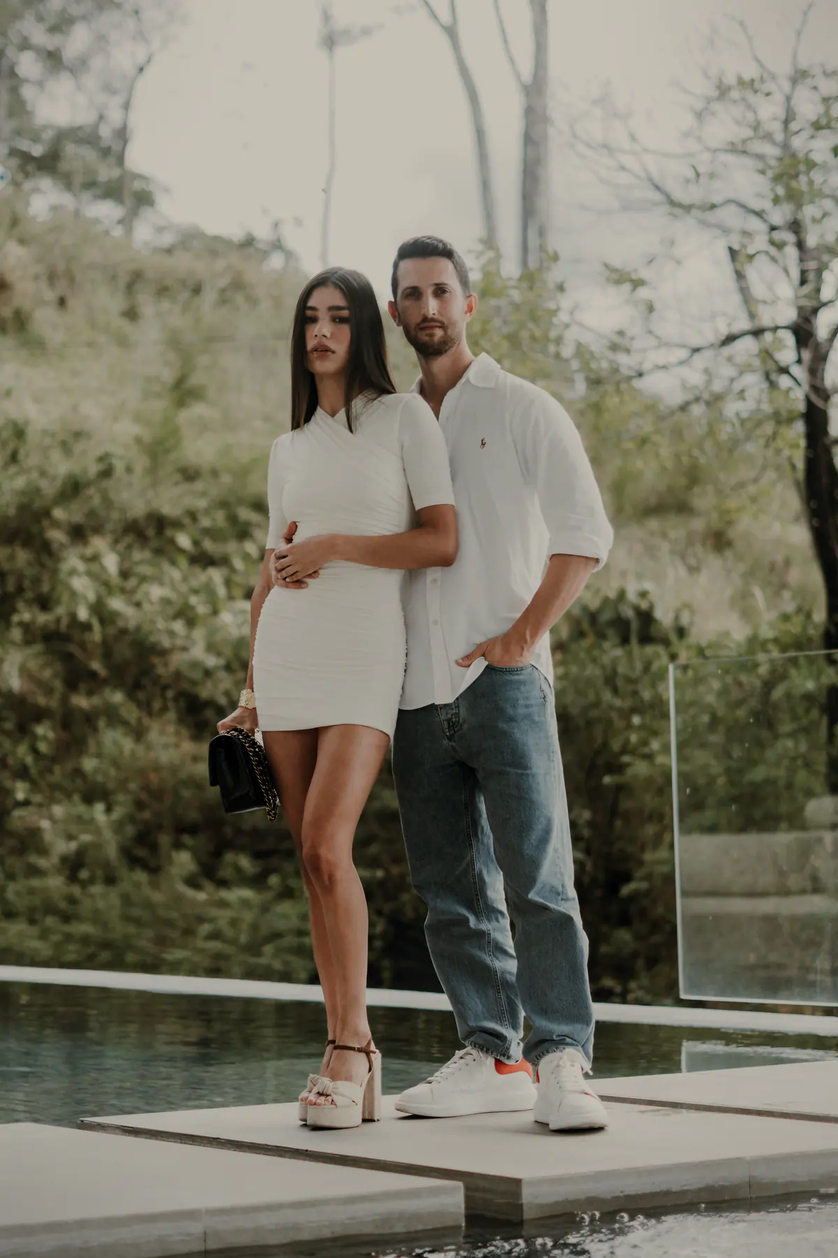Daniel Jacob, founder of Everlasting Confidence, standing with a woman by a pool.
